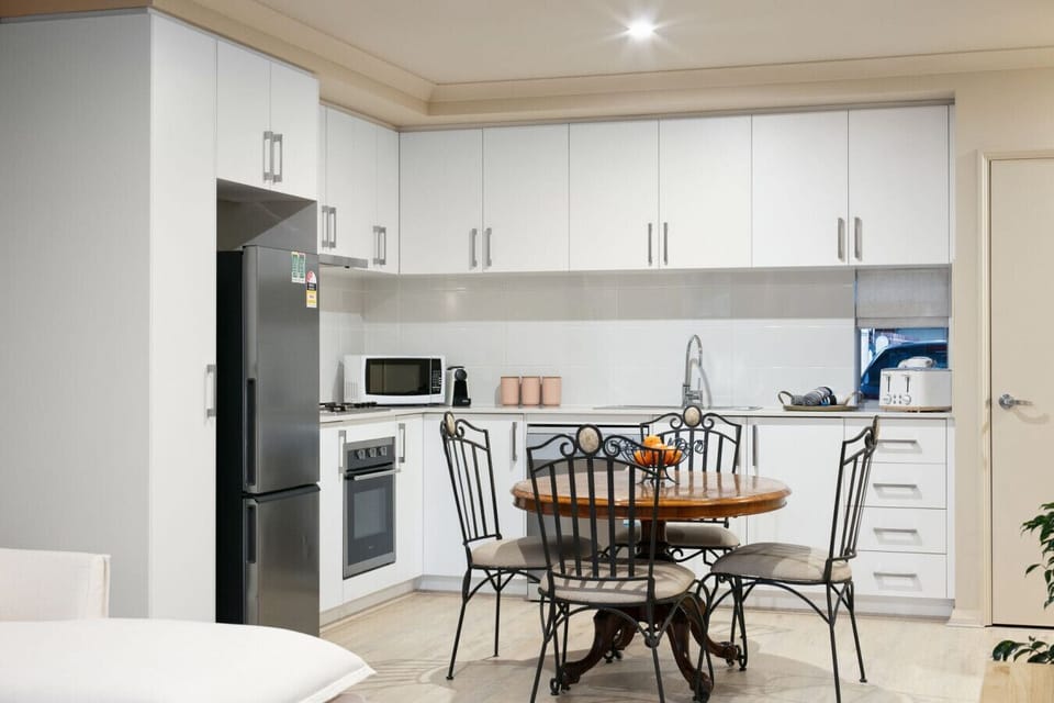 Open-plan dining and kitchen with warm, inviting styling