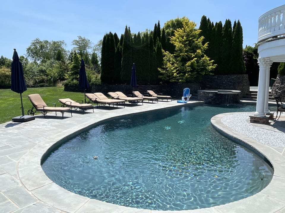 Pool with Lounge Chairs and Umbrellas 