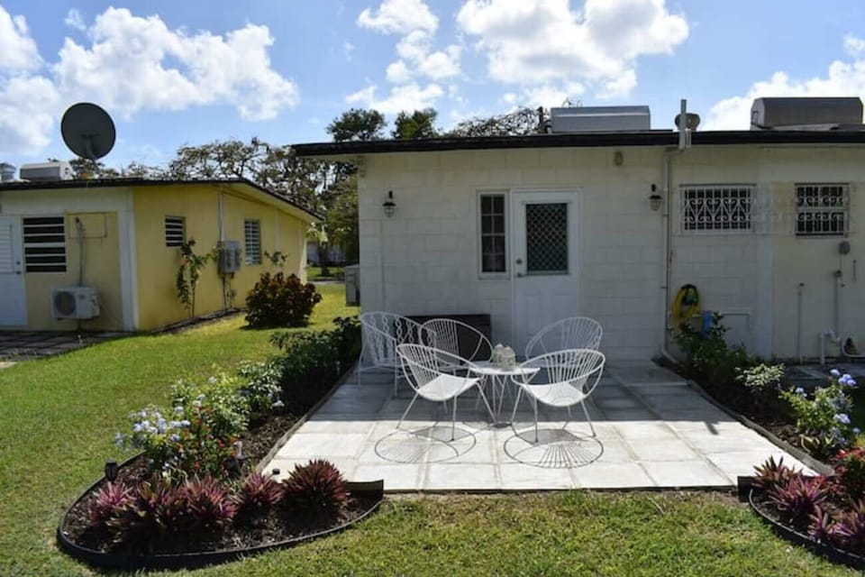 Enjoy the back patio with tropical garden!