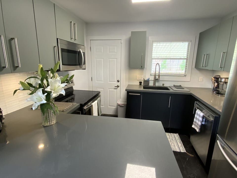 UPDATED KITCHEN WITH STAINLESS STEEL APPLIANCES
