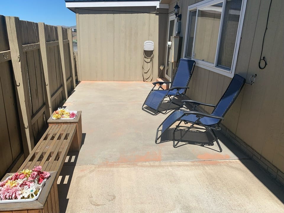 Enjoy the enclosed patio with lounge chairs