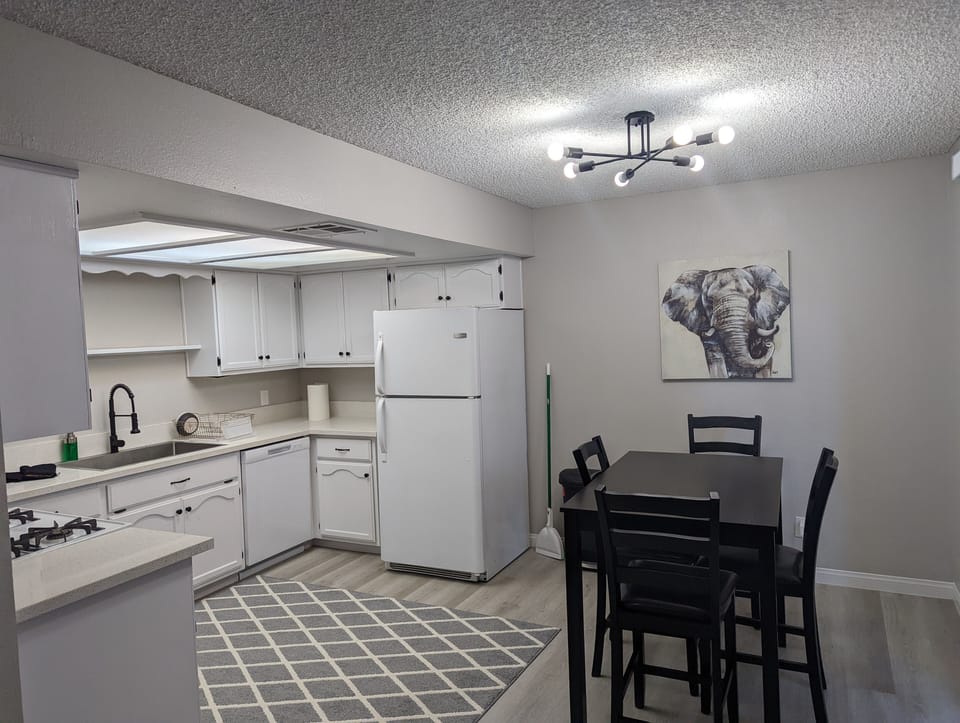 Another view of the spacious kitchen area and dining table.