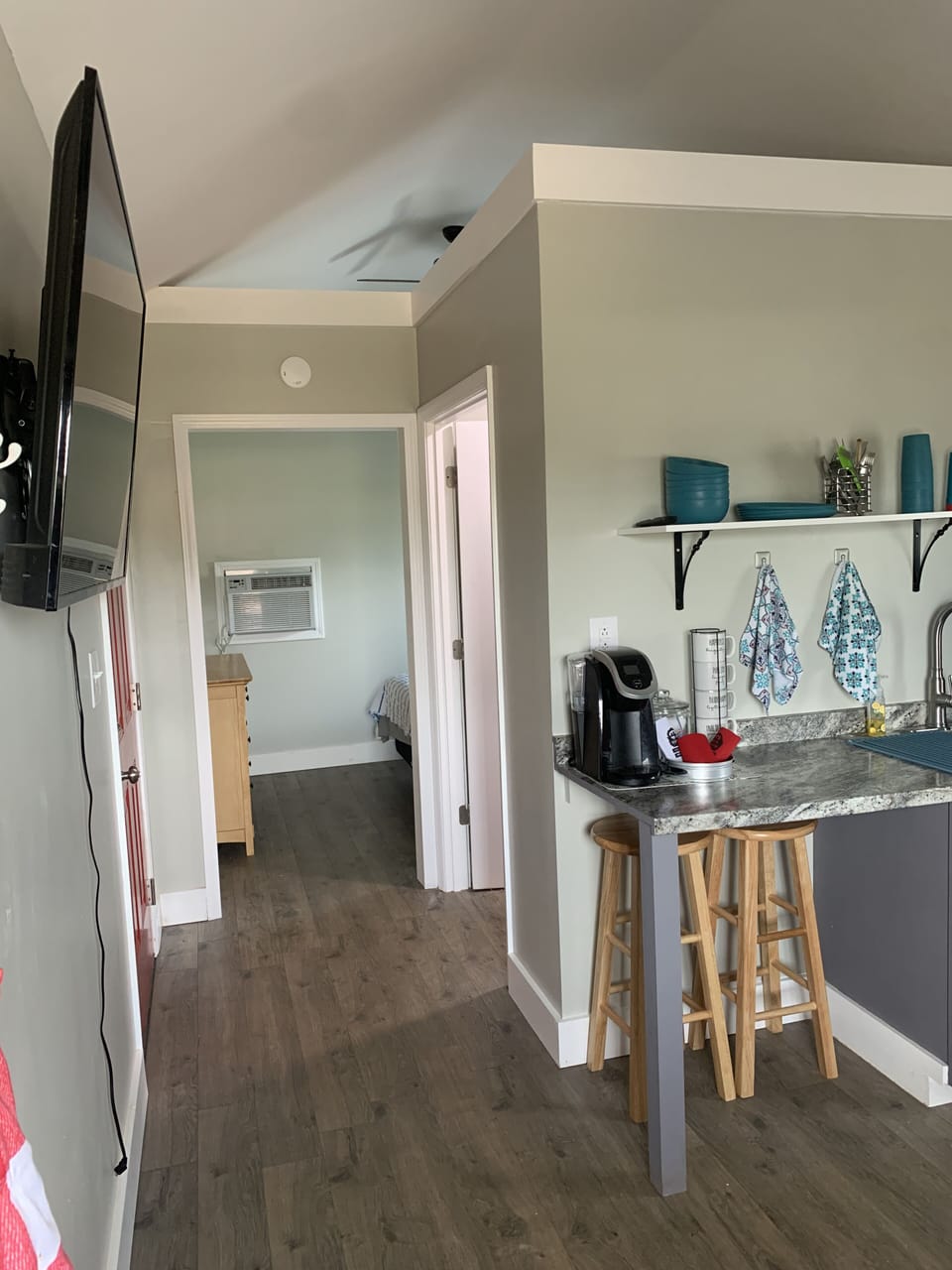 Hallway to half bath and bedroom. 