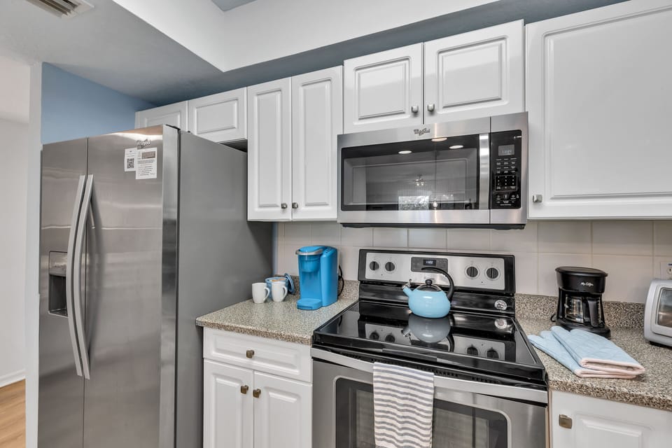 kitchen with double door refrigerator with built in ice maker and filtered water