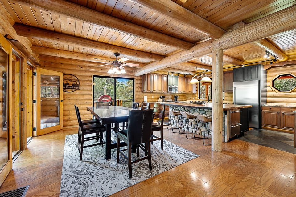 Open dining and kitchen area perfect for family meals and cabin gatherings.