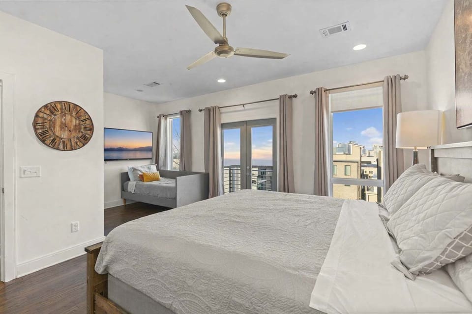 Bedroom 4 features a king bed, twin daybed, private attached master bathroom, and balcony for a spacious and relaxing stay.