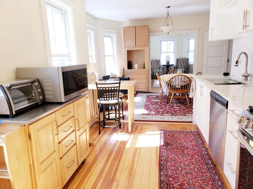 View of Kitchen Towards the Dining Room + Living Room