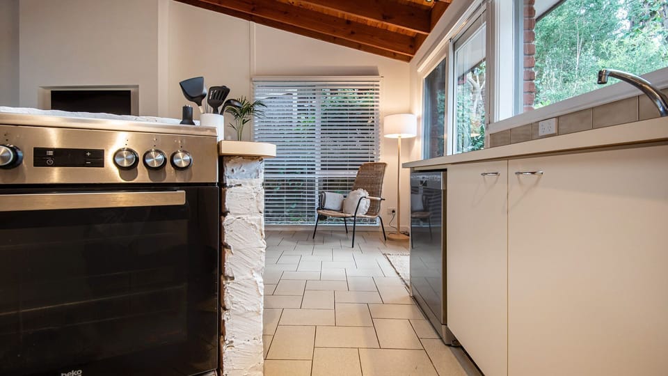 The centerpiece of the kitchen is a spacious and versatile cooking area.
