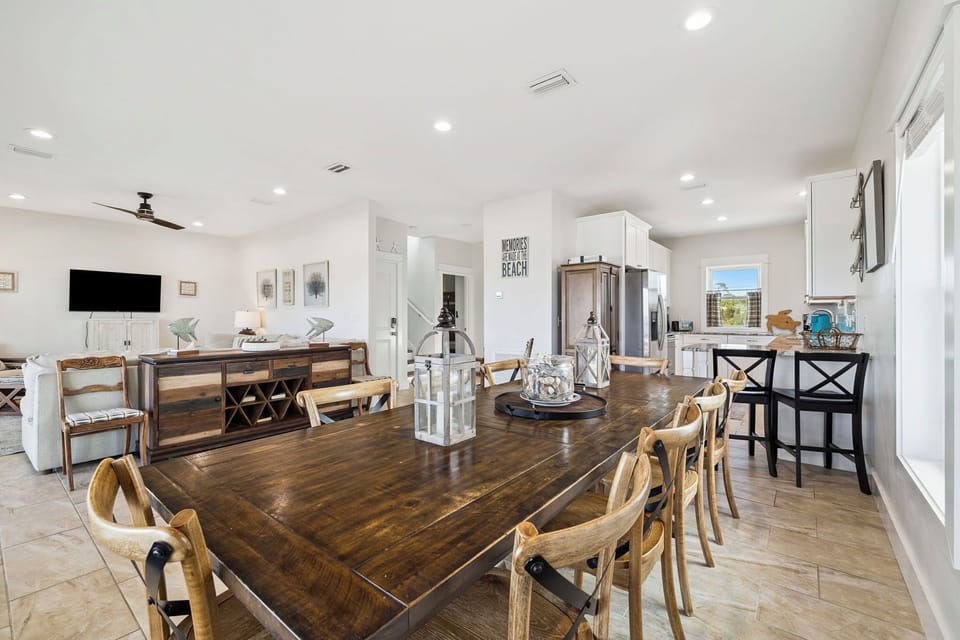 Gather around this spacious farmhouse-style table, where your group can share meals, stories, and beach memories in this bright open-plan space.