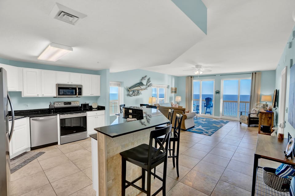 Your stunning oceanfront retreat features a fully-equipped kitchen and open living space where you can cook, dine, and relax with breathtaking sea views.