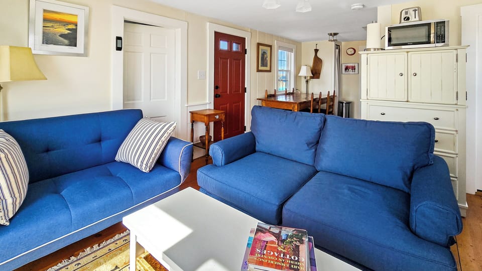 Bright and cozy main living area with living room, dining area and kitchen