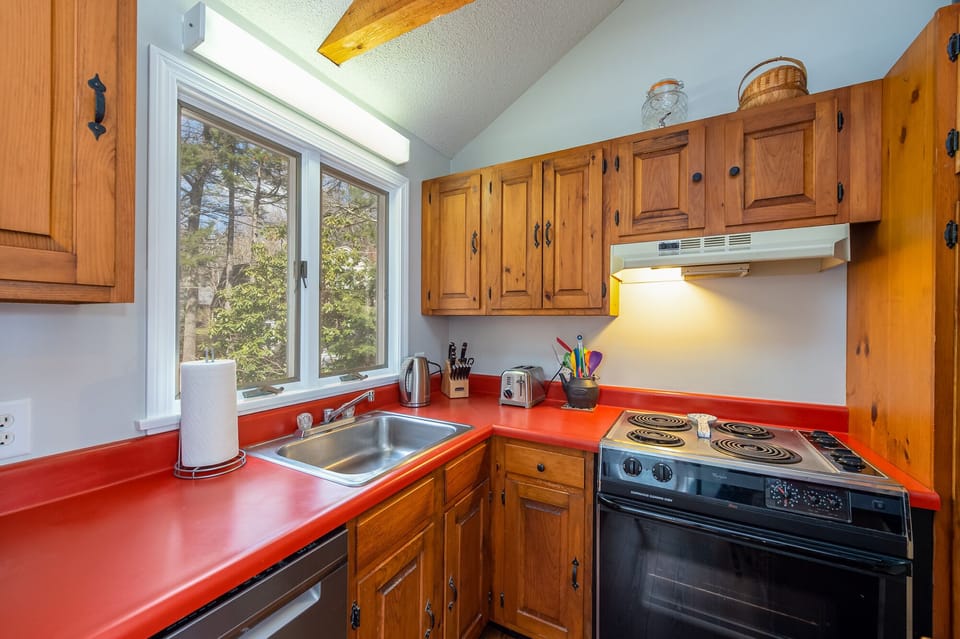 Kitchen with electric stove.