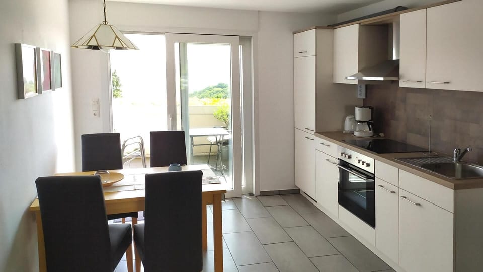 Kitchen area. Kitchen with eating place and access to the eatside terrace
