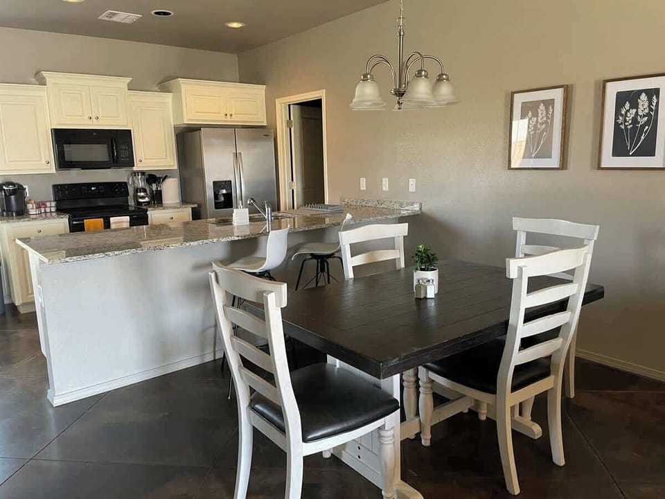 [Dining Area] Formal Dining area with seating up to 4 with 2 additional seats at bar 