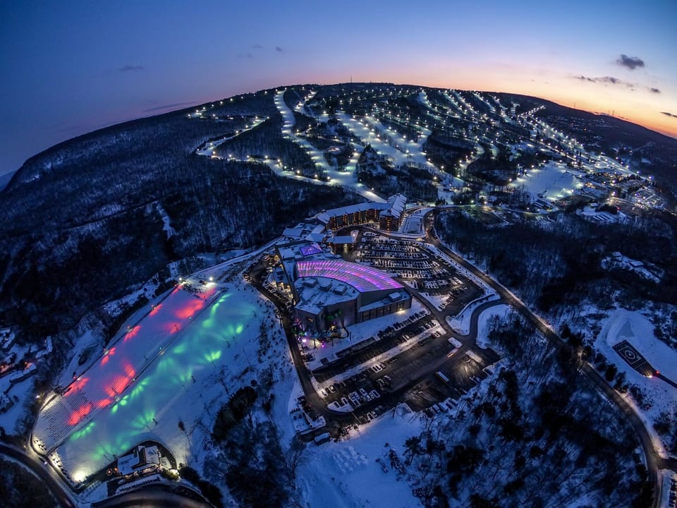 Ariel view of Camelback Resort in the winter. With 39 Ski trails and 42 snowtube lanes, there's something for the entire family to enjoy.