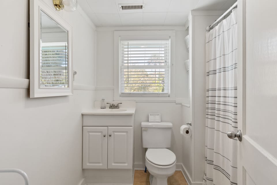 Full bath with tub shower