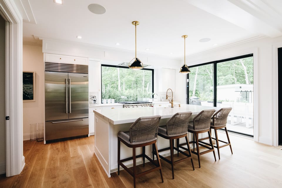 High end eat-in Chef's kitchen with Wolf Range and SubZero fridge.