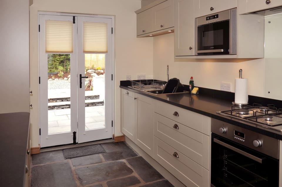 No.3 The Forge kitchen with patio doors to rear garden