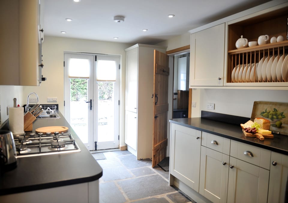 No.4 The Forge kitchen with patio doors to rear garden