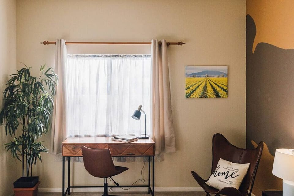 Bedroom has a desk for those working from home.