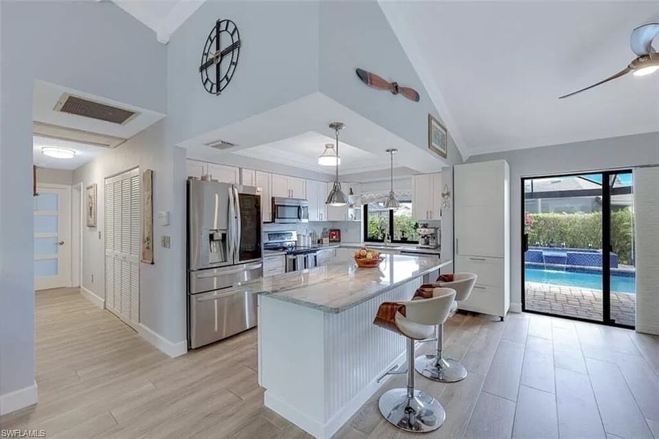 Big open kitchen and family room opens out onto the pool and spa.