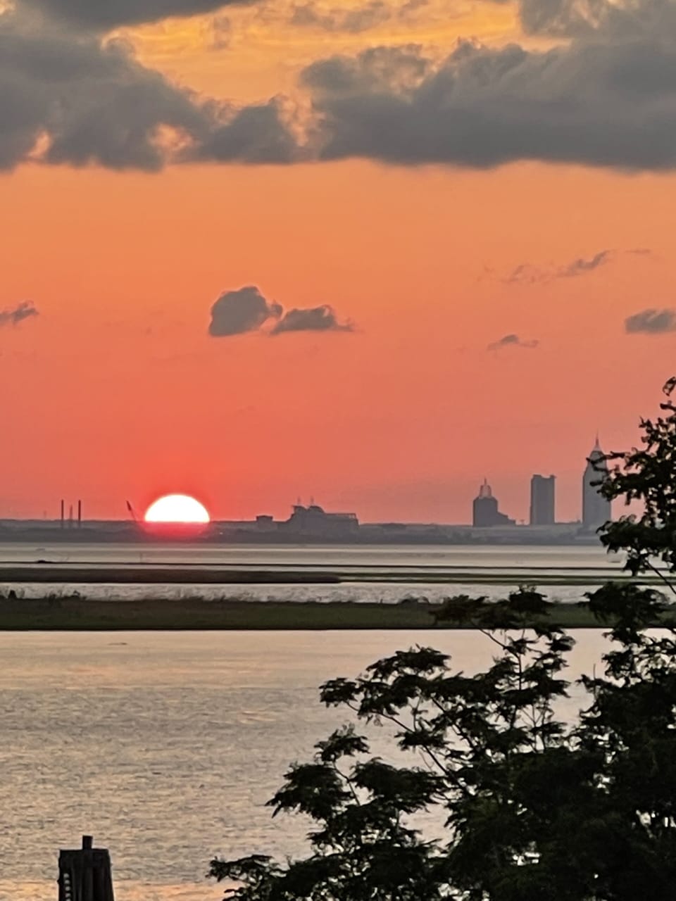 Sunset as viewed from the green space just off the deck of the condo.