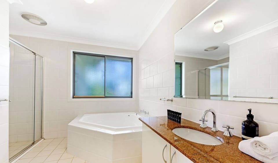 Relaxing bathroom with bathtub available