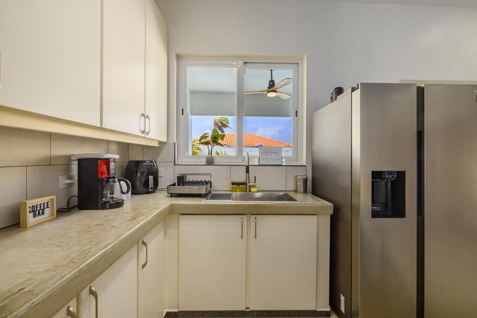 The full kitchen has a large kitchen counter that adds more dining space for your family.