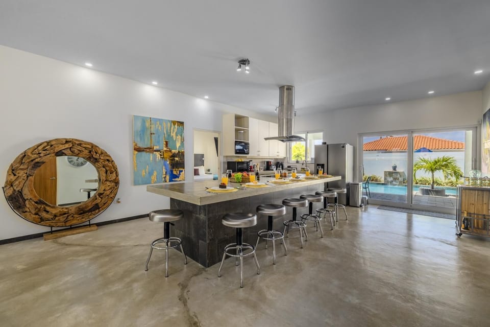 The full kitchen has a large kitchen counter that adds more dining space for your family.