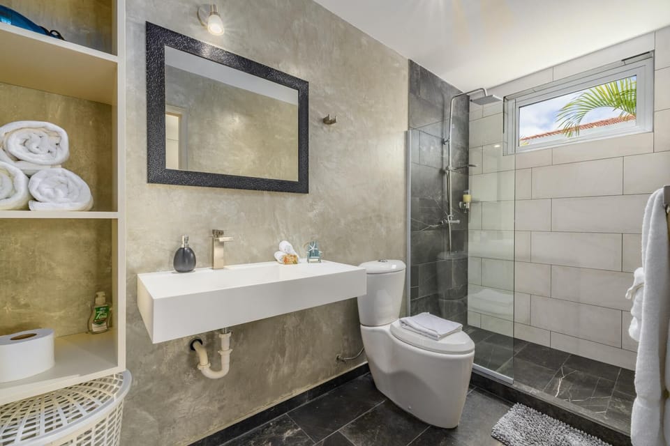An elegant bathroom design complete with amenities.