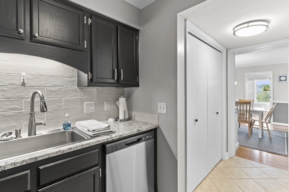 Kitchen- Hall closet with full washer and dryer