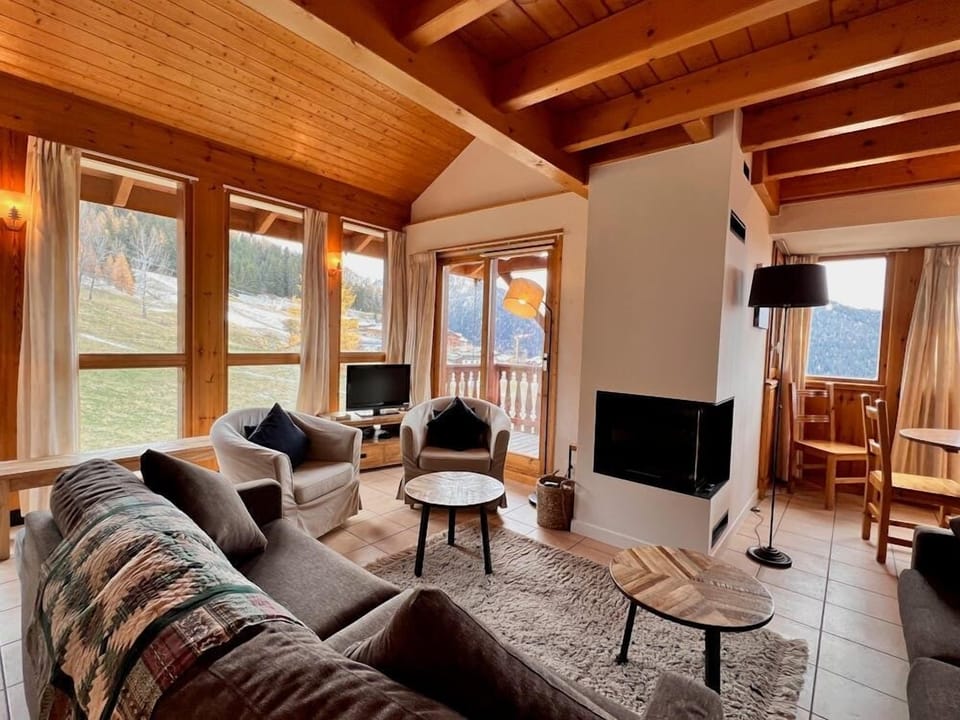 Lounge view over the piste with an open fire
