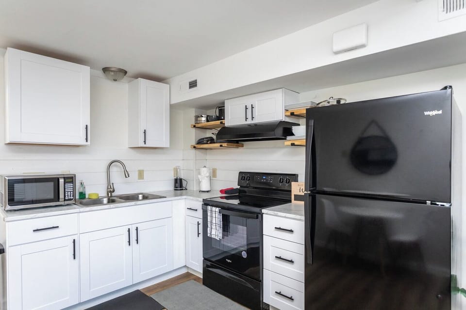 Full-size kitchen with refrigerator, stove/oven, and microwave
