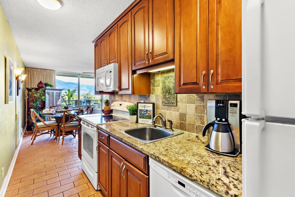 Fully stocked kitchen featuring granite countertops