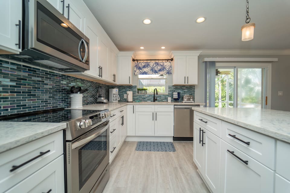 Kitchen with seating for 12 including dining table and island 