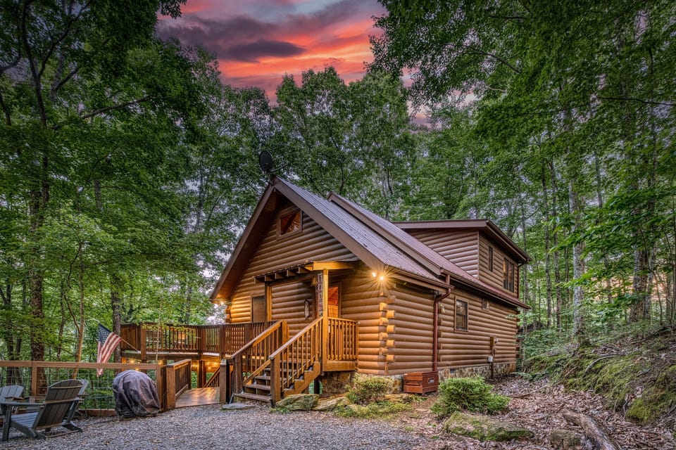 Golden hour in Blue Ridge—soak in the stunning mountain views and peaceful forest surroundings as dusk settles over the cabin. A perfect end to a day in nature.