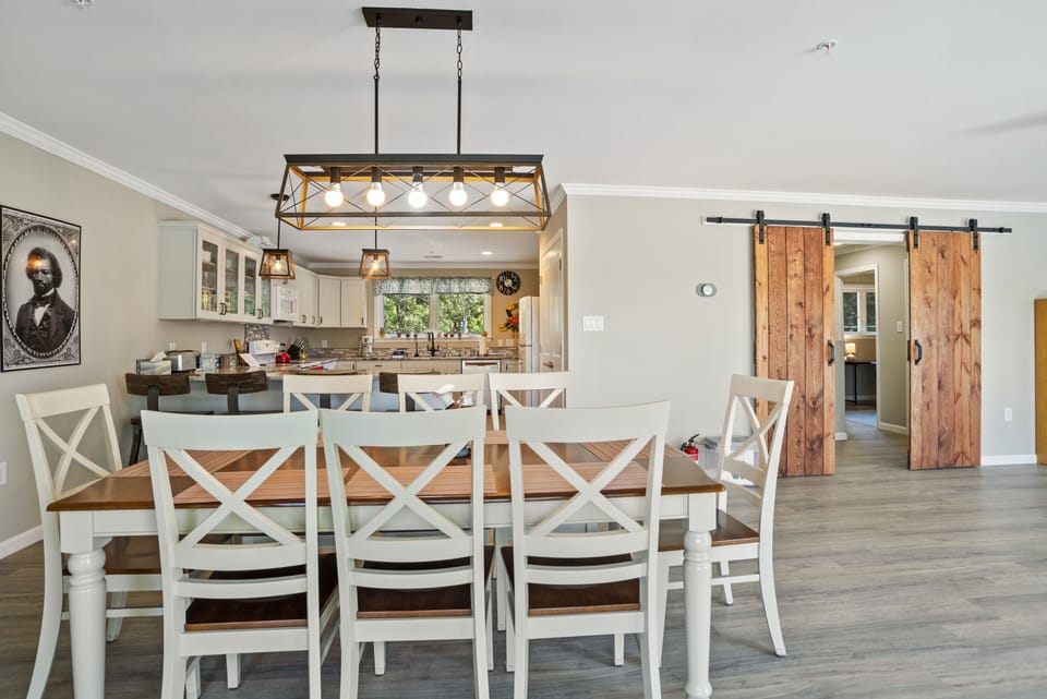 3rd floor dining table for 8 with 4 bar stools at counter.
