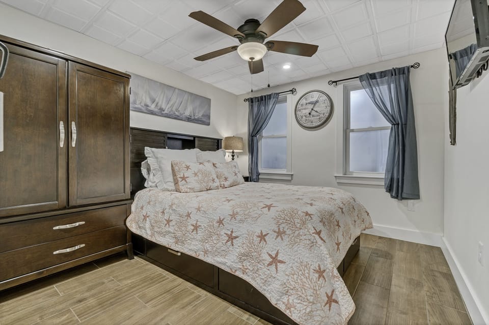 Queen Bed with smart TV.