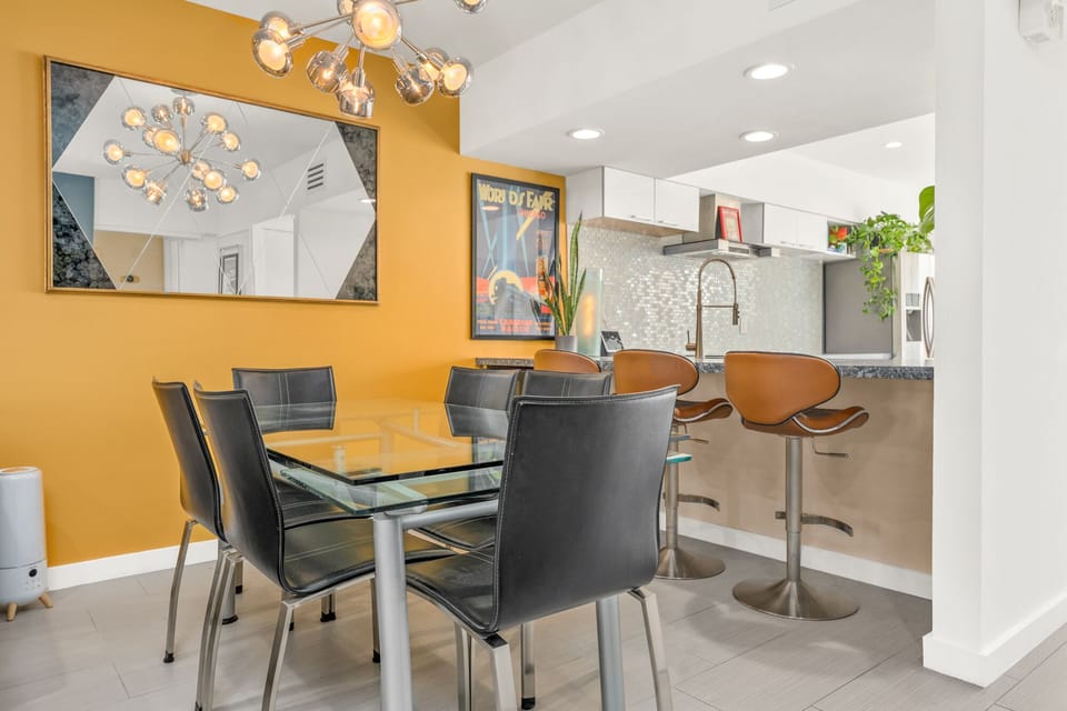 Dining area with seating for 6 and a breakfast nook with seating for 3. 