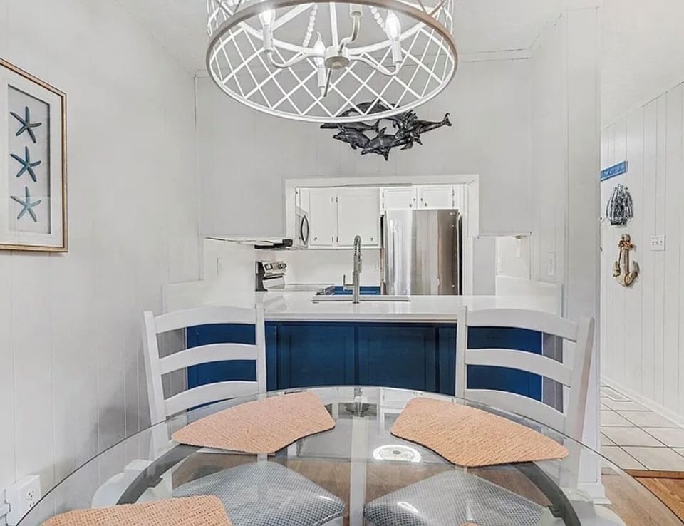 Dining table with kitchen view.