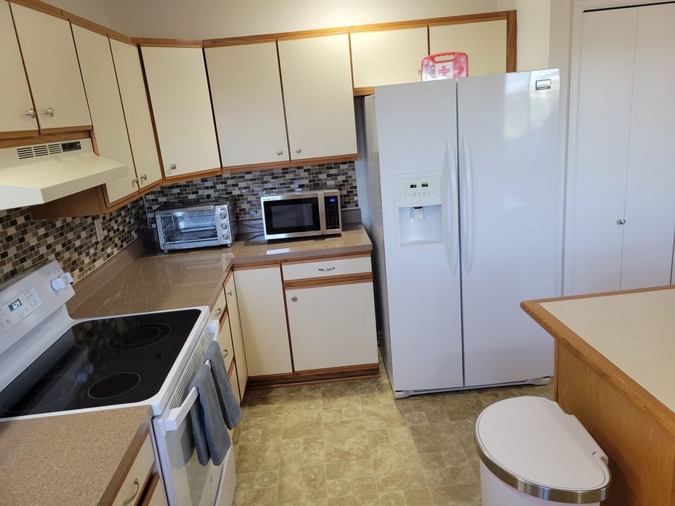 Electric cooktop, oven, air-fryer oven,  microwave and fridge 