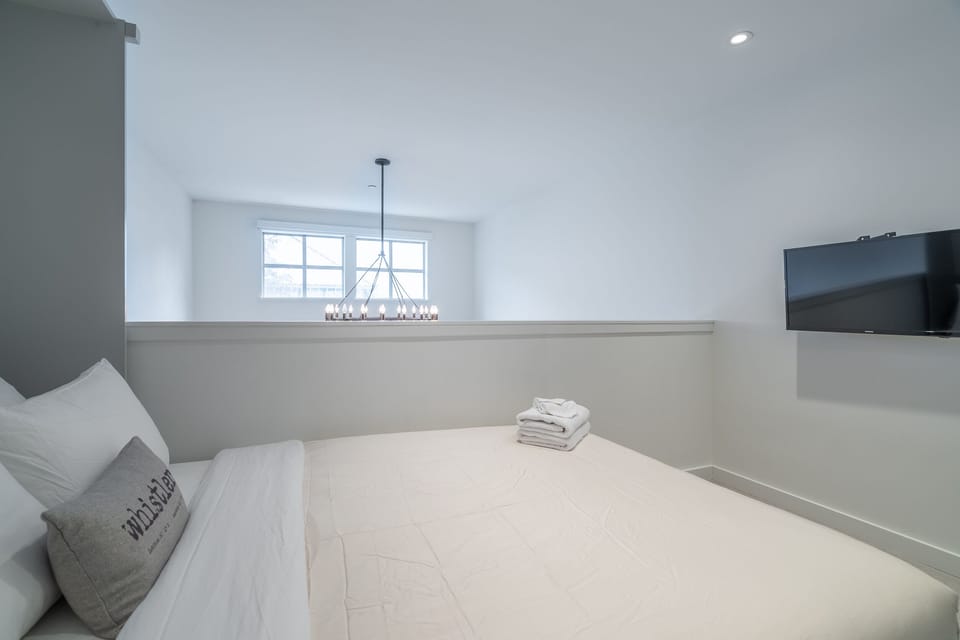 Relax in our third loft bedroom with a queen-sized bed and a 55" HD TV.