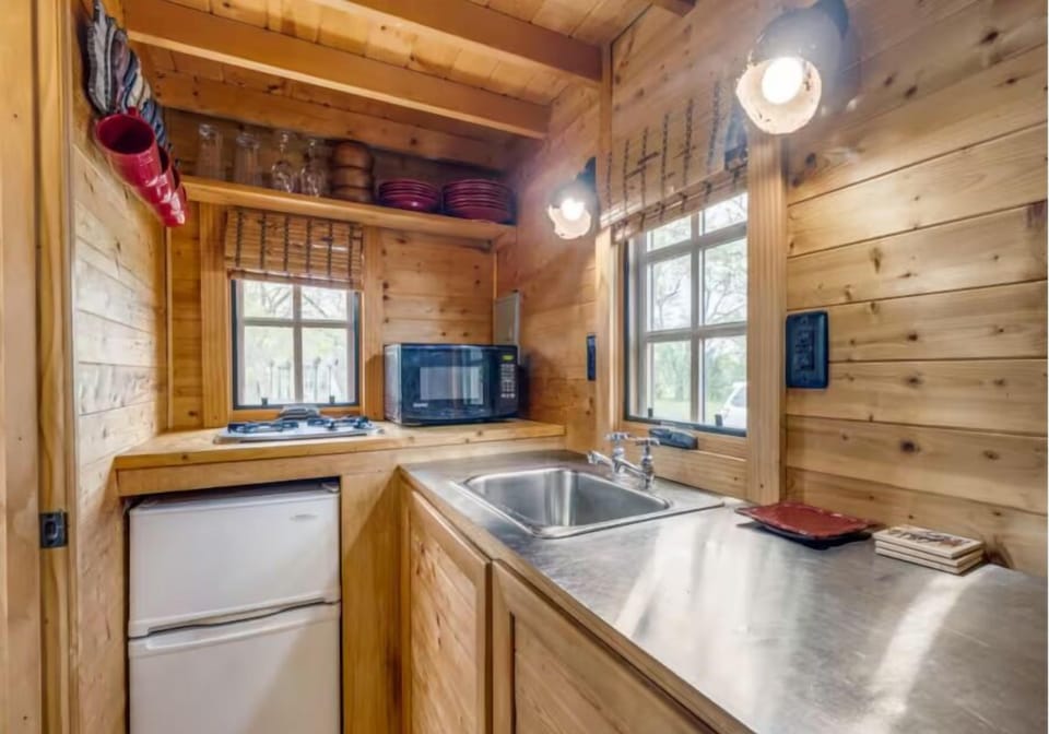 Kitchenette K-cups Coffee maker, Microwave, Air conditioningStove, Refrigerator, Cooking basics, Fire extinguisher. 4 burner gas grill is available on the owner's porch for guest use.