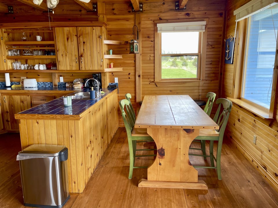The kitchen table has great views over the water and has ample room for everyone