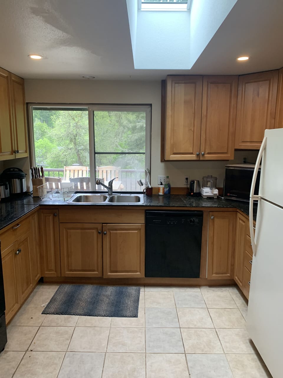 Kitchen is nice and big, with a new sky light, and mostly new appliances
