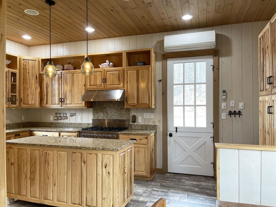 Enter from the front porch and into the gourmet kitchen.
