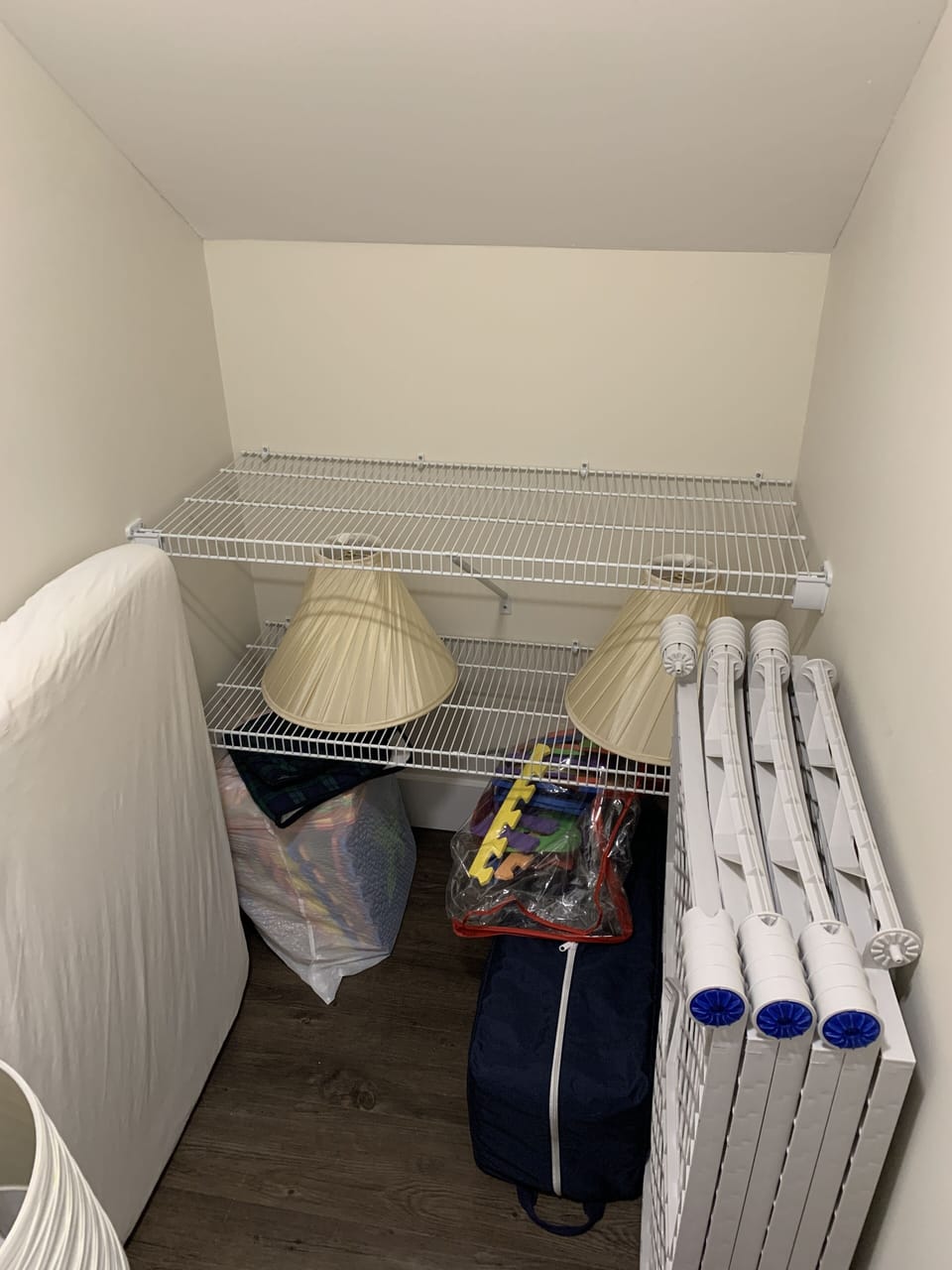 Closet under the stairs with gates and pack and play
