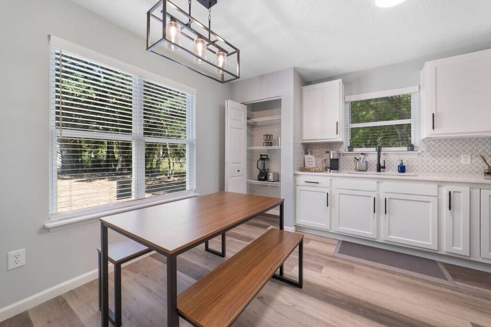 The kitchen has a large pantry for added storage and is stocked with supplies.