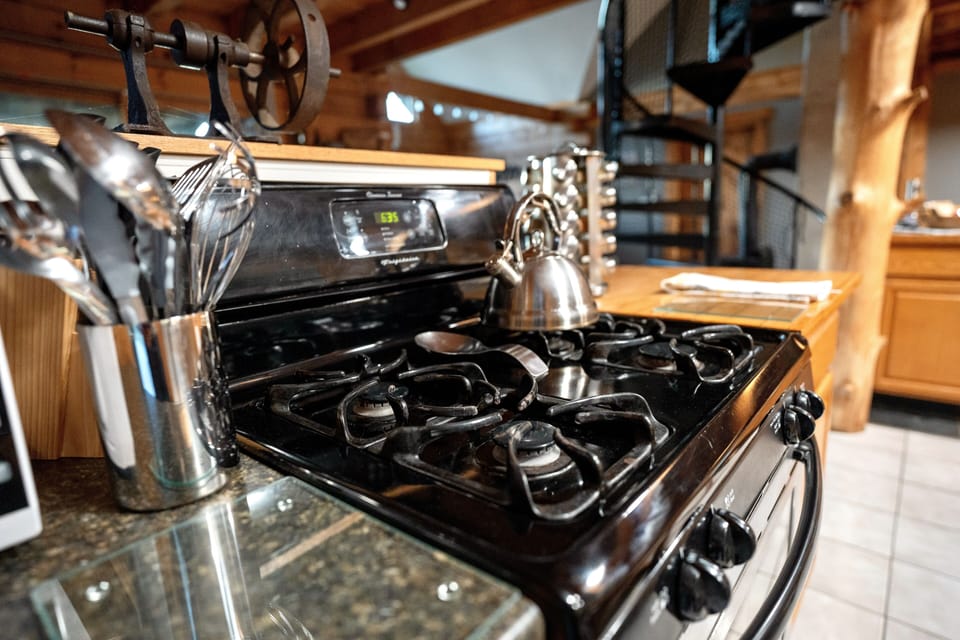 Gas stove and oven. Revolving spice rack, knives, cutting boards & microwave.