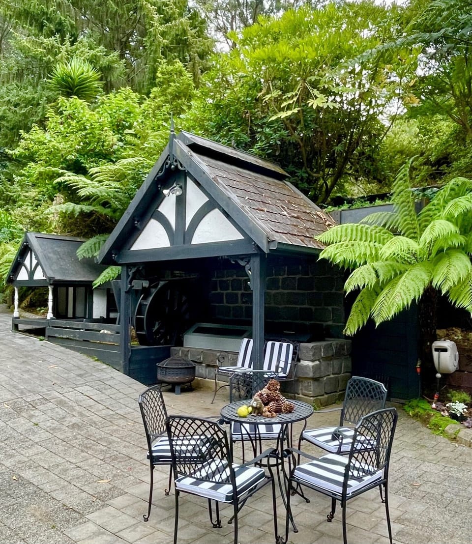 Outdoor area with waterwheel.